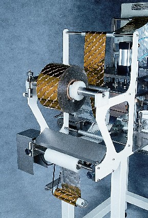 Foto 4 - Biscoitos maquina tekpack para aplicação selo